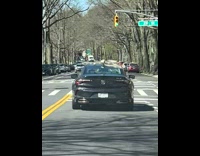 Cup left on car roof falls and spills coffee 