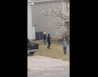 Three kids playing outside judging 