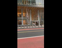 Guy walk zorb ball beside bank street