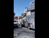 Trailer home parked on street being towed 