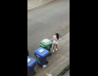 Girl white shirt dance tiktok green trash bin