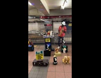 Guy plays saxophone with lots of animatronics