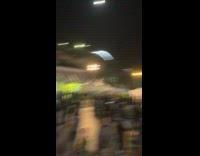 Boy in white polo takes a slam while scootering a halfpipe