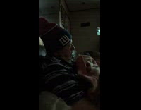 Girl pinches nose of guy NY beanie 