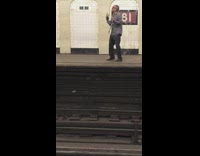 Collab Subway Creatures - man in grey shirt and tie singing in subway station