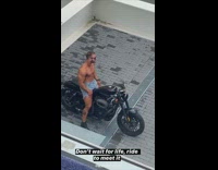 Shirtless guy black motorcycle jean cutoffs tattoo 