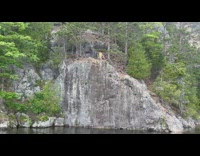 Little kid jumps off cliff into water 