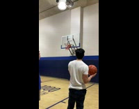 Guy in white shirt throws basketball at hoop and friends rip clothes