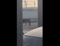 Parking lot dance tripod guy brown shirt 