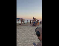 People stack on top of each other at the beach