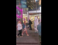 Person wearing astronaut costume walks around times square 
