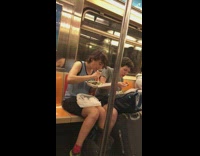 two guys eating food from white boxes