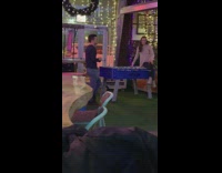 IITW - A woman sits on top of a blue foosball table