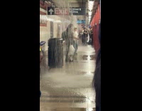 Water pours down from subway station ceiling