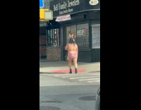 Woman crossing wearing slutty bunny outfit