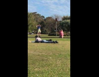 Man blue top green shorts rollerblades public park Part 1