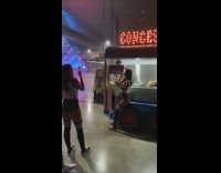 Girl poses in front of concessions