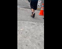 Man walk street wear device on ankle