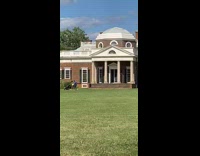 Girl sits grass white dome roof house