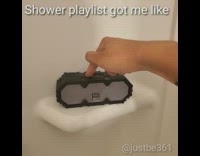 Guy showers with shower playlist, milly rocks in bath tub with shirt on and timbs