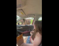 Girl afraid of ostrich head in car 