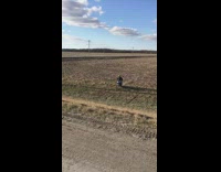 Motocross biker jumps over road ramp and crashes bike on ground