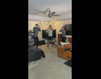 Three friends play blindfolded water fan game