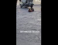 Woman black dress lie down ground cathedral