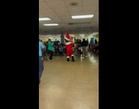 Ernie the elf dancing at Christmas party