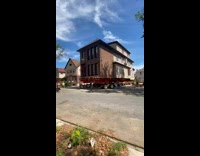 Whole house on wheels is being moved