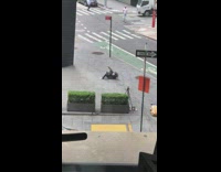 Guy rolls on ground and stands slowly 