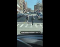 Man covered in medieval armor walks down street
