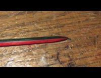 Guy shows homemade diy green red sword 