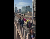 Woman in pink yoga outfit on the bridge
