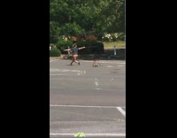 Guy practice sword fencing stick parking lot