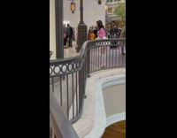 White skirt girl talks to phone camera 