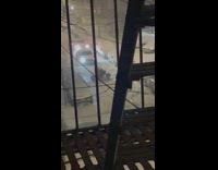 Person on ATV doing circles on snow covered street block traffic