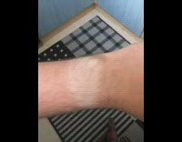 Person show wristwatch tan line on wrist