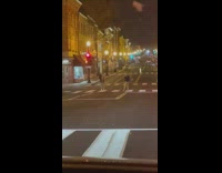 Woman white tank top bag pedestrian lane