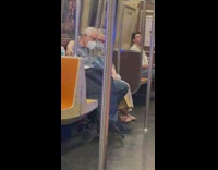 Old couple sits in train 