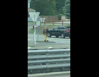 Man yellow satin pants dance USA flag intersection