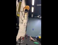 Cameraman yellow shirt above handrails gym barbell