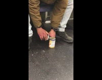 Guy on subway opens can of soup 