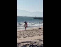 Woman in bikini with bag beach video