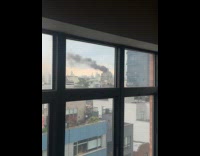 Submitter sees building on fire from window