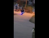 Little boy sitting on hoverboard one wheel u turns 