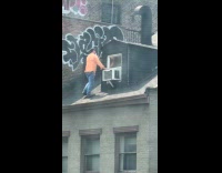 Man walks on roof without safety harness