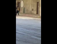 Black shirt girl sits on strangers motorcycle 