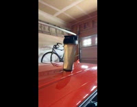 Tumbler slowly inching down from car roof