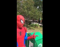 Two guys dressed up as spiderman on school campus